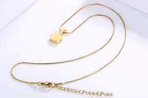 Detail shot of the golden guitar pendant necklace with an adjustable lobster clasp