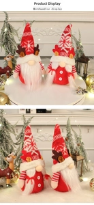 Close-up of knit Christmas gnomes with snowflake patterns and festive reindeer antlers