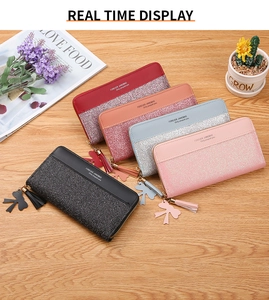 Detailed arrangement of long glitter wallets in five colors with tassels and bow charms