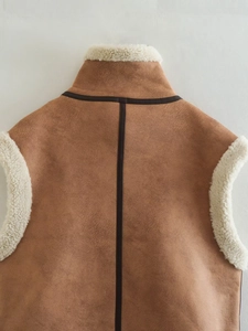 Detail of brown faux suede vest showing sherpa fleece collar and soft inner texture