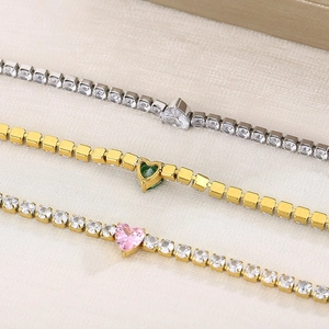 Three elegant heart-shaped tennis bracelets in gold and silver finish with colorful gemstones