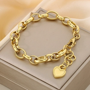 18K gold-plated chunky link chain bracelet with a heart pendant on a display box