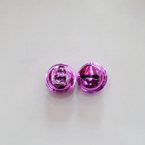 Macro detail of glossy purple metal bells with vacuum plating and top hanging holes
