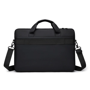 Detail of laptop bag back showing trolley strap for luggage attachment and shoulder strap