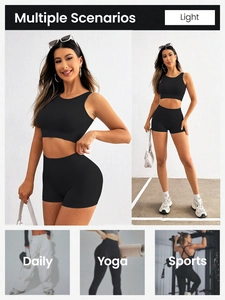 Detail of black ribbed seamless workout set featuring high-waist shorts and crop top tank