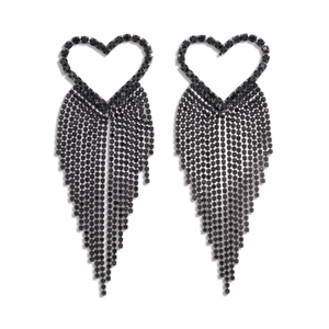 Exaggerated black heart tassel earrings with rhinestones in minimalist studio lighting