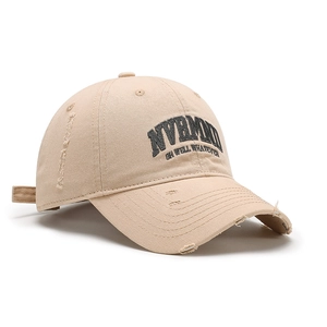 Distressed khaki baseball cap with NVRMND embroidery and vintage ripped details