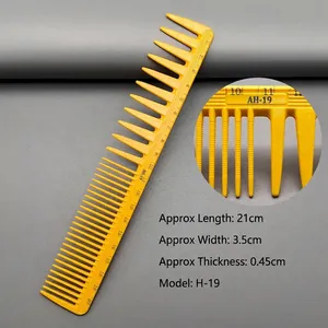 Detail view of yellow hair comb with scale markings showing 21cm length and H-19 model