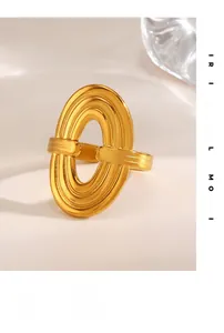 Detail of 18K gold plated stainless steel ring with multi-layered textured oval hollow design
