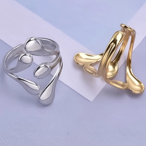 Detail of minimalist 304 stainless steel rings in liquid metal drop design for women