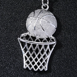 Detail of silver basketball and hoop keychain with realistic texture and metallic finish
