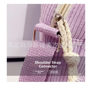 Detail of purple corduroy fabric with metal strap ring and white braided rope accent