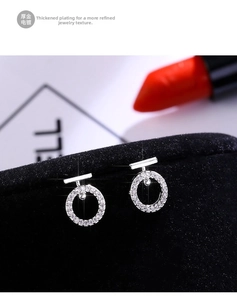 Macro shot of silver S925 sterling silver hoop earrings with micro-set zircon crystals