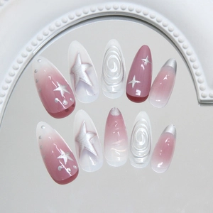 Long almond press on nails with pink gradient and silver star designs on mirror base