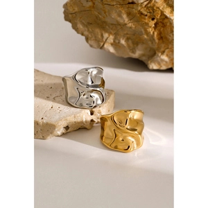 18k gold and silver stainless steel rings with unique hammered lava texture on rock