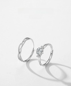 Close-up of S925 sterling silver Mobius couple rings with sparkling zircon inlay