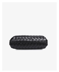 Black leather woven bag detail, minimalist luxury style, elegant shoulder purse bottom.