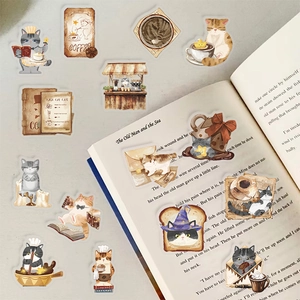 Hand-drawn Magic Cat Cafe PET waterproof stickers displayed on vintage book pages