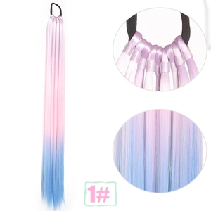 Macro detail of the braided synthetic hair extension with pink and blue gradient effect