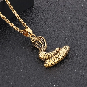 Golden cobra pendant necklace in titanium steel with twisted chain on black background