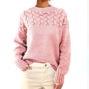 Detailed cable knit pattern on pink long sleeve sweater with soft textured finish