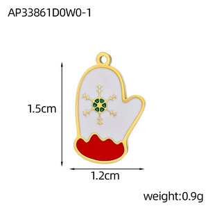 Macro view of a Christmas glove pendant with enamel finish and gold snowflake detail