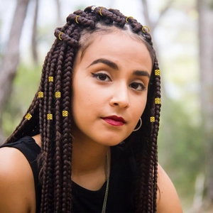 245 pieces of gold metal dreadlock hair accessories on model for braided hairstyles