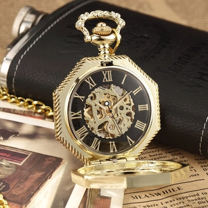 Detailed macro view of vintage gold hollow pocket watch with mechanical gears and Roman numerals