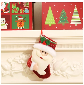 Festive Christmas stocking hung on a fireplace with sequins and plush details for holiday decor