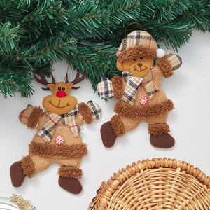 Detailed view of burlap elk and bear Christmas ornaments with festive plaid scarves