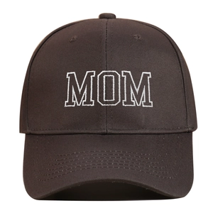 Detailed view of white MOM embroidery on dark brown cotton twill baseball cap texture