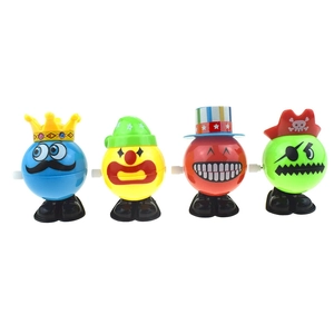 Set of four wind-up walking clown toys with colorful hats for holiday gifts