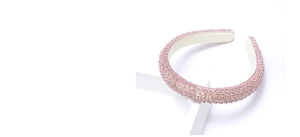 Close-up of pink rhinestones on a luxury padded headband with premium leather lining