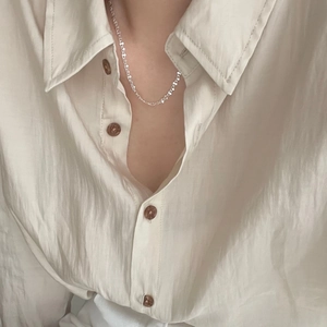 S925 sterling silver minimalist thin chain necklace for women worn on a white shirt