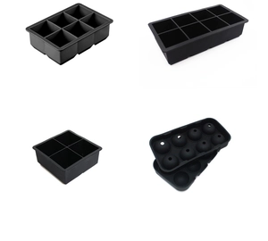 Black food-grade silicone ice molds set in square and sphere shapes for whiskey
