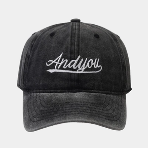 Retro washed denim baseball cap in charcoal black with white Andyou cursive embroidery