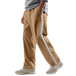 Detail of men corduroy casual pants showing side stripes and rich fabric texture