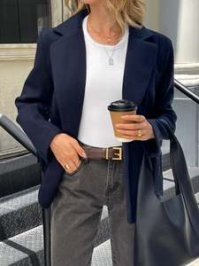 Elegant navy blue vintage jacket styled with casual jeans and a large black tote bag