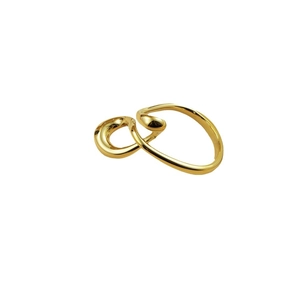 Statement twisted music note ring in polished gold finish with textured bold design