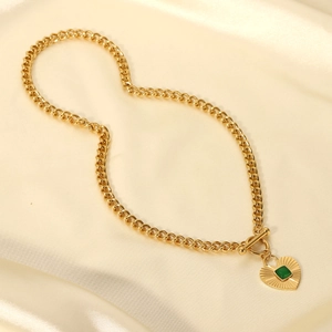 Golden chunky chain necklace with heart pendant, green gemstone and OT toggle clasp