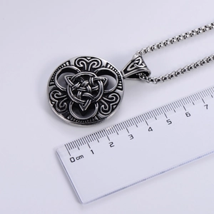 Nordic Viking Celtic knot pendant necklace in vintage silver finish on white background