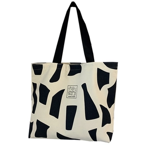 Artistic canvas tote bag with abstract black patterns and Good Student rabbit patch