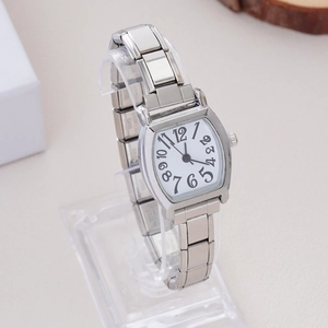 Detail of silver rectangular watch dial with Arabic numerals and flexible metal link chain