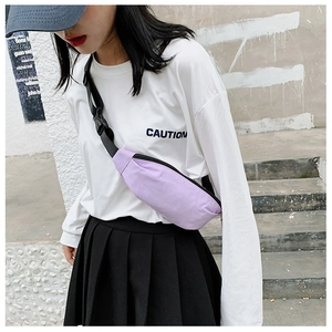 Street style shot of light purple canvas fanny pack with adjustable strap on a model