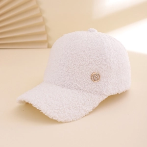 White lamb wool baseball cap with sparkling rhinestone R logo on warm beige backdrop