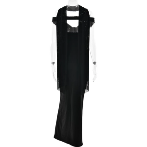 Detail of elegant black strapless dress featuring sheer mesh patchwork and cutout design