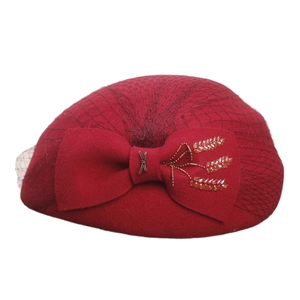 Elegant red wool beret featuring mesh veil and bow with exquisite bead embroidery