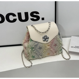 Detail of silver flower buckle and colorful rainbow lattice fabric on the chain backpack