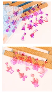 Detailed view of DIY Christmas themed silicone molds with glitter resin earrings and charms