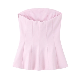Detailed view of pink peplum tube top with ruffled hem and hidden side zipper